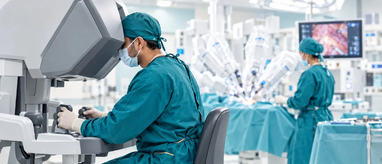 Surgeon operating a robotic-assisted surgery console